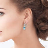 7x5 MM Oval Shape Aquamarine and 1/6 ctw Round Cut Diamond Earrings in 14K White Gold